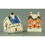 An early 19th century Staffordshire pottery cottage form money box,
