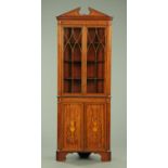 An Edwardian inlaid mahogany standing corner cabinet,