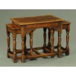 A nest of three carved and turned oak tables, by Titchmarsh & Goodwin, mid 20th century,