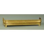 A Victorian brass fire kerb, raised on short front legs. Width 125 cm.