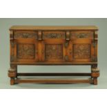 A George V carved oak sideboard,