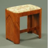 An Art Deco walnut veneered dressing stool, with upholstered seat,