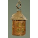 A 19th century copper candle lantern, with carrying handle and side door, height 39 cm.