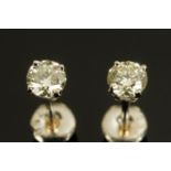A pair of 18 ct white gold diamond stud earrings, total diamond weight +/- .51 carats.