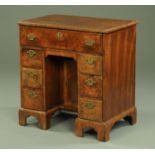 A George III walnut kneehole secretaire desk,