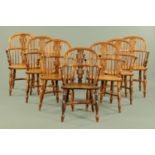 A matched set of seven 19th century yew wood Windsor chairs, 6 + 1, with pierced splat backs,