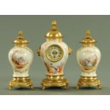A Victorian gilt metal mounted porcelain clock garniture, with single-train movement,