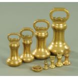 A set of brass bell weights, Victorian, largest 7 lbs, smallest 1 oz.