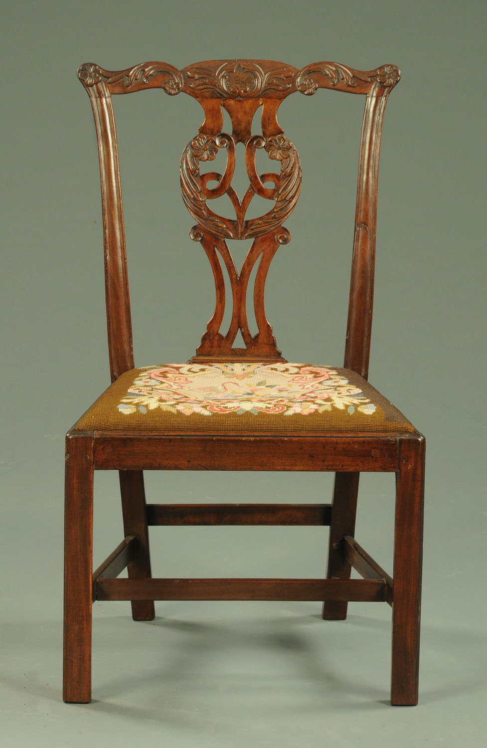 A Georgian mahogany side chair, with finely carved top rail and splat,