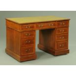 An Edwardian inlaid mahogany pedestal desk,