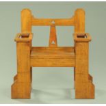 An Arts & Crafts oak combined hall seat and stick stand. Width 86 cm (see illustration).