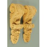 A pair of carved lime wood corbels, foliate and fruit, height 42 cm, width 13 cm.