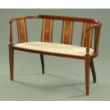 An Edwardian inlaid mahogany settee,