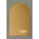 An Art Deco pink glass mirror, arched and with ship motif, 92 cm x 60 cm.