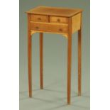 An Edwardian inlaid mahogany side table, satinwood crossbanded and fitted with three frieze drawers,