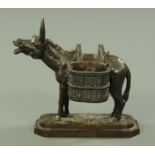 A well patinated cast iron match holder, 19th century,