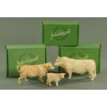 A Beswick Charolais bull, cow and calf, each with printed marks, the bull 22.