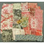 A large quantity of vintage fabrics, some with figural and pastoral designs.