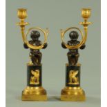 A pair of 19th century gilt and patinated bronze candelabra,