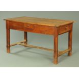 A 19th century French fruitwood dining table,