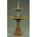 A cast iron fountain, two tier, with column support.