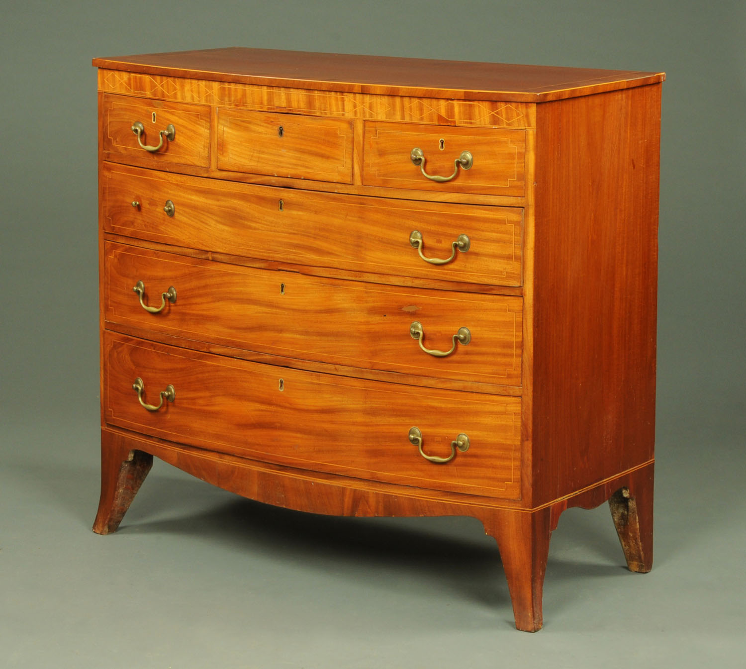 A late Georgian mahogany bowfronted chest of drawers,