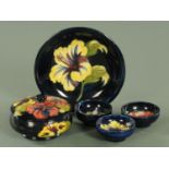 A small collection of Moorcroft pottery, mid 20th century, comprising bowl and cover,