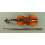 A 3/4 size violin, 20th century, with two piece back, 55 cm overall, together with a 67.