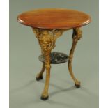 A Victorian cast iron pub table by Gaskell and Chambers, Preston, with mahogany top, diameter 65 cm.