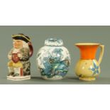 A 19th century Staffordshire Toby jug and cover, modelled holding a foaming quart and a pipe,