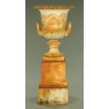 A large cast iron garden urn on stand,