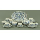 A Continental porcelain Onion pattern part dinner and tea service, comprising a large dished plate,