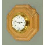 A Robert Mouseman Thompson of Kilburn octagonal wall clock, with quartz movement. Width 18.