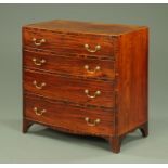 A George III mahogany bowfronted chest of drawers, with rosewood banded edge,