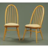 A pair of Ercol side chairs, each with tall back, solid seat and turned legs.