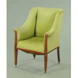 An Edwardian inlaid mahogany wing chair, upholstered in green fabric,