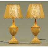 A pair of painted metal table lamps, in the George III style,