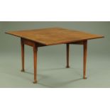 A Georgian mahogany drop leaf dining table,