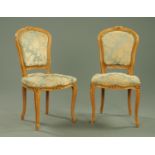 A pair of French carved beech salon chairs, with upholstered backs and seats, early 20th century,