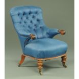 A William IV rosewood button back armchair, upholstered in blue,