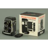 A Mamiya C220 professional camera, W/80 mm, F 2.8, in almost new condition and in original box.