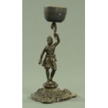 A 19th century French bronze figural candlestick, male figure holding aloft a sconce. Height 28 cm.