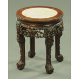 A 19th century Chinese carved hardwood jardiniere stand, with white marble top and beaded edge,