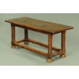 An antique oak refectory table, of good colour, with planked top,