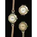 Three early 20th century silver cased ladies wristwatches.