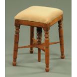 A Regency mahogany square topped stool, stuffover,