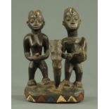 A Yoruba carved wood figure of male and female musicians, 20th century,