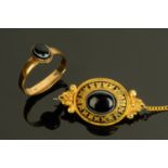 A Victorian 22 ct gold ring, size M, and a gold coloured metal brooch with safety chain.