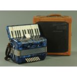 A Marino Pigini piano accordion, with marbled blue body with 32 buttons, in original carrying case.