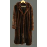 A ladies full length fur coat by Charles Fischelis.